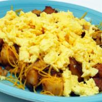 Chuck Wagon Special · Home fries covered with cheese and topped with 2 eggs any style and toast or biscuits.

 *Co...