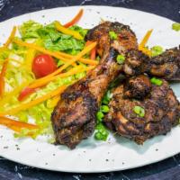 Jerk Chicken · Spicy. Pieces of chicken marinated in a fine blend of Jamaican herbs and spices, grilled and...