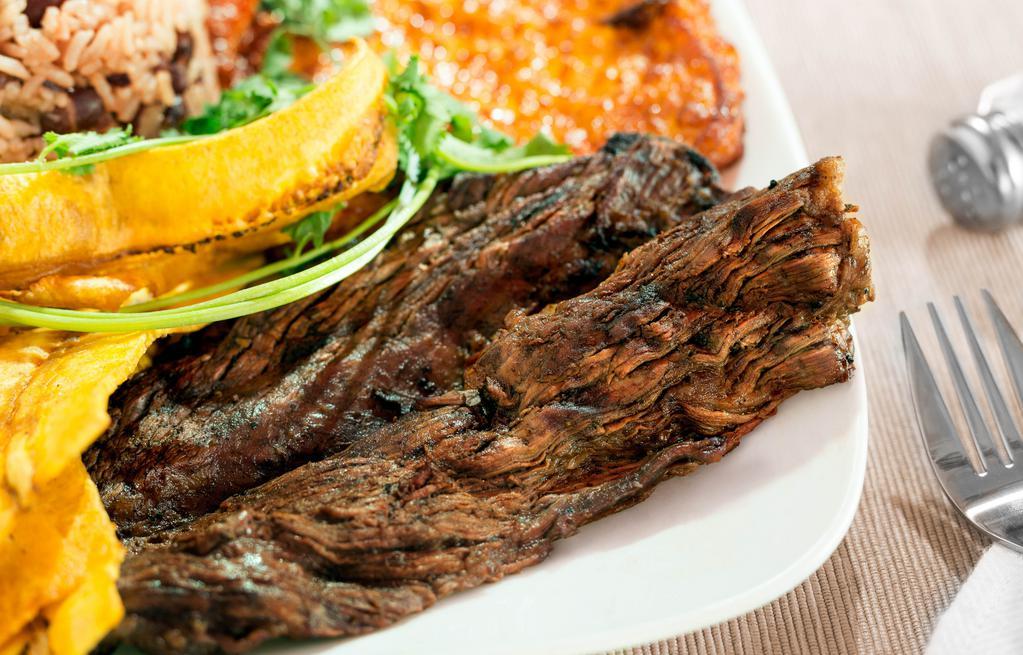 Carne Asada · Charbroiled marinated beef steak. Includes coleslaw (repollo).