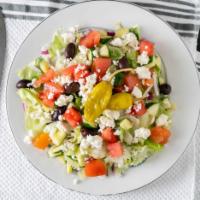 Authentic Greek Salad · Tossed chilled greens, chopped tomatoes, red onions, Greek olives, cucumbers, feta cheese an...