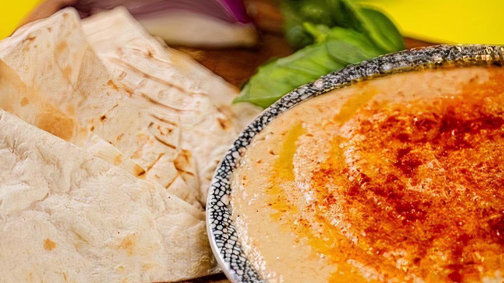Hummus · Mixture of mashed chick peas, tahini sauce, lemon juice, fresh garlic and olive oil (V)