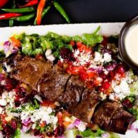 Chenjeh Large Plate · 1 Chenjeh Kabob (Seasoned Tenderloin Chunks). Served with your choice of Grain or Salad and ...
