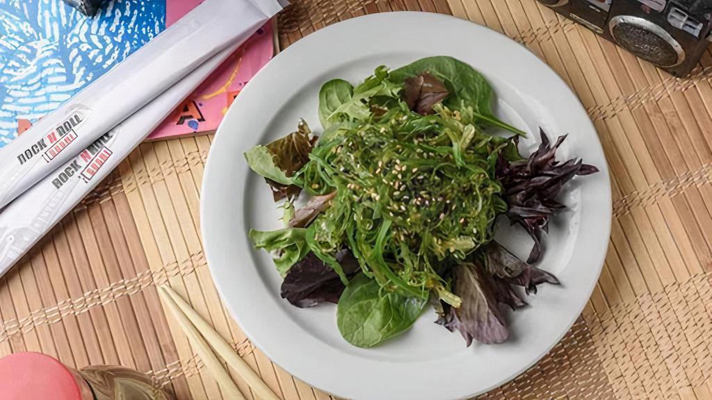 Seaweed Salad · Sweet and savory wakame seaweed on spring mix.