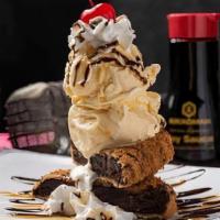 Hall Of Fame Brownies · A towering stack of golden-fried brownie. slices, vanilla ice cream, whipped cream,. chocola...