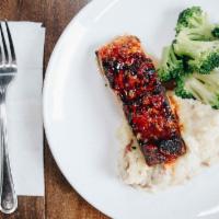Tropical Glaze Salmon · Fresh atlantic salmon topped with a sweet glaze, served with garlic mashed potatoes and broc...