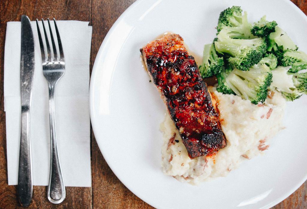 Tropical Glaze Salmon · Fresh atlantic salmon topped with a sweet glaze, served with garlic mashed potatoes and broccoli.