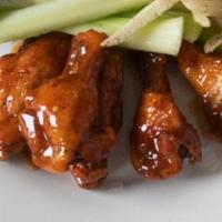 Olg Signature Wings · Fried then grilled, tossed in OLG hot sauce.