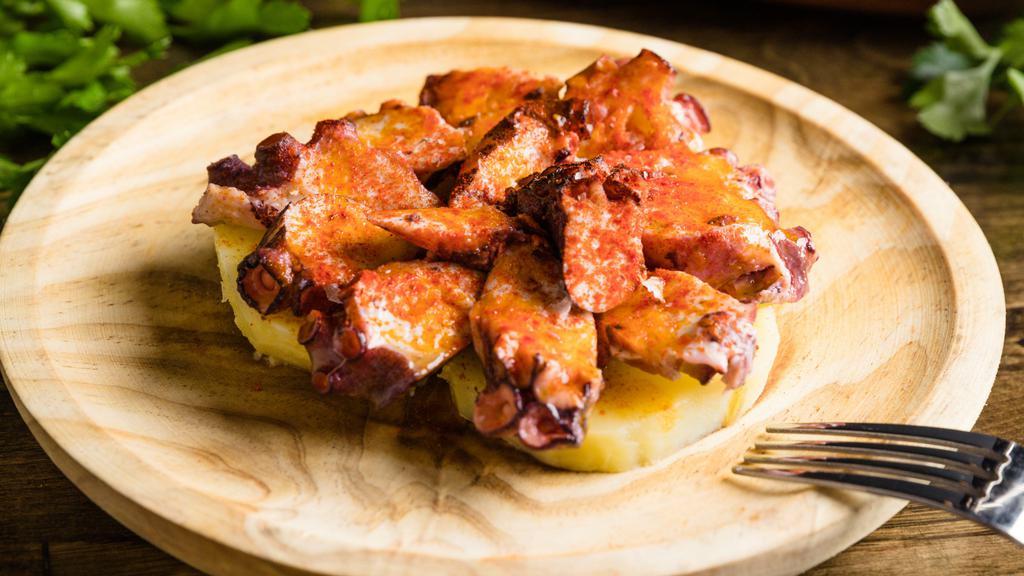 Pulpo A La Gallega · Dairy-free, gluten free. Galician style octopus seasoned with paprika and sea salt, extra virgin olive oil, and served over potatoes.