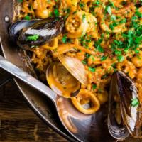Marisco Paella (For 2) · Dairy-free, gluten free. Rice, calamari, shrimp, scallops, mussels, and clams.  minimum orde...