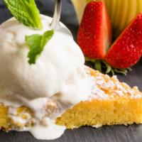 Tarta De Santiago Con Helado · Spanish almond cake served with ice cream.