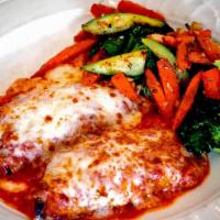 Chicken Parmigiana · Chicken Breast that has been tenderized & hand breaded, topped with marinara & fresh mozzare...