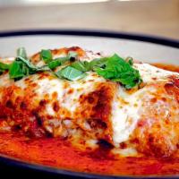 Homemade Lasagna · Layers of house made Bolognese, mozzarella, tender pasta, marinara & topped with creamy vodk...