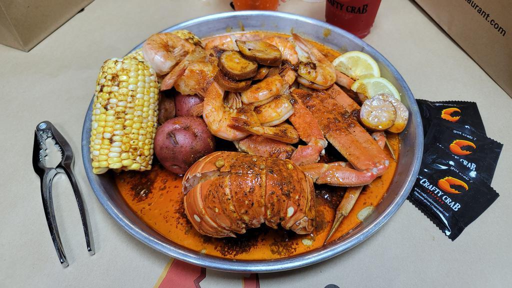 Lobster Special  · One Lobster tail, 1/2 lb snow crab, 1/2lb headless shrimp, 2 potato, 2 corn, 1/4 sausage
