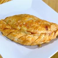 Beef Empanada · Golden brown, dough pastry with ground beef and Argentinian spices.