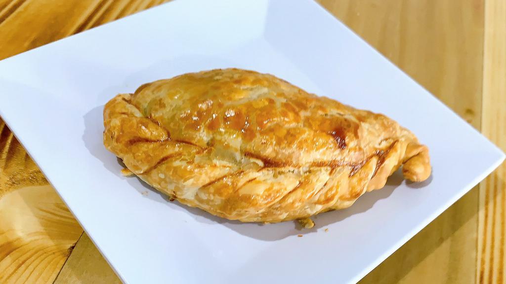 Beef Empanada · Golden brown, dough pastry with ground beef and Argentinian spices.