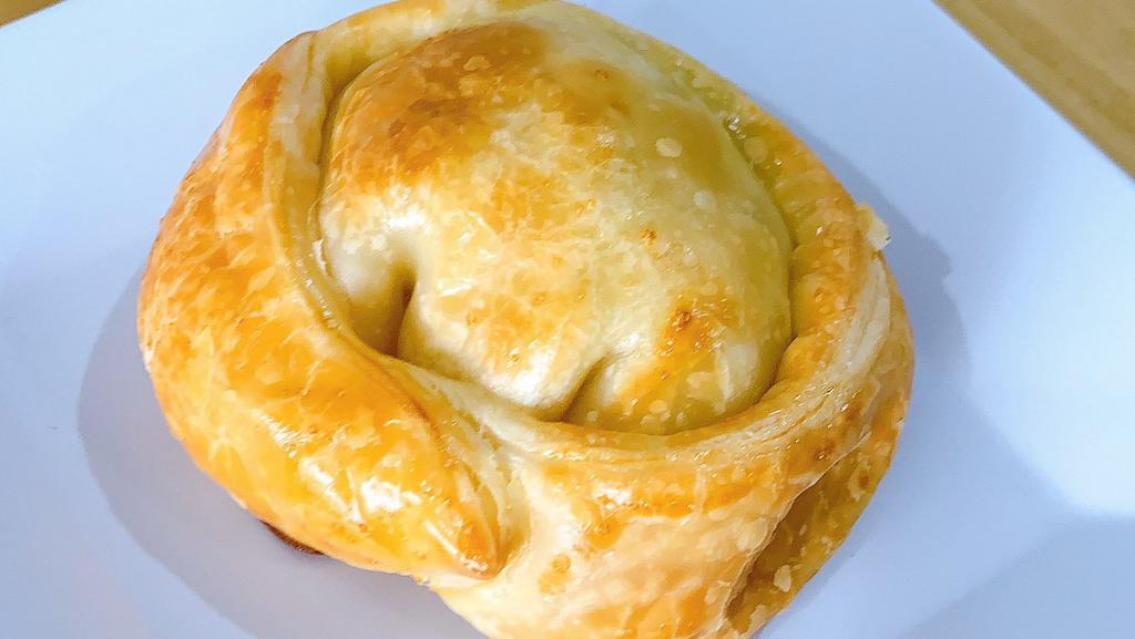 Aji De Gallina Empanada · Golden brown, dough pastry with creamy spicy chicken.