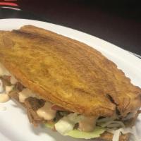 Patacón Mixto · Sandwich of sweet fried plantains filled with grilled beef and chicken (mixed) or with shred...