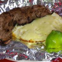 Grilled Steak (Asada) · Grilled steak served with an arepa with mozzarella cheese topping, pico de gallo is optional.