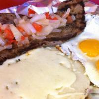 Early Morn (Madrugon) · Grilled steak, pico de gallo, arepa with mozzarella cheese topping and two eggs cooked to ta...