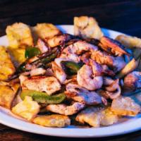 Fajitas Habaneras · Grilled Shrimp & Chicken served on Tostones w/ Green Peppers & Onions