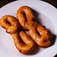 Bunuelos En Almibar · Sweet Yuca Fritters w/ Syrup