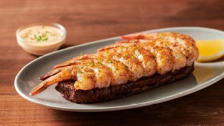 Grilled Shrimp On The Barbie · Seasoned with a special blend of herbs and spices then flame grilled. Served with Outback’s own garlic toast and classic rémoulade sauce.