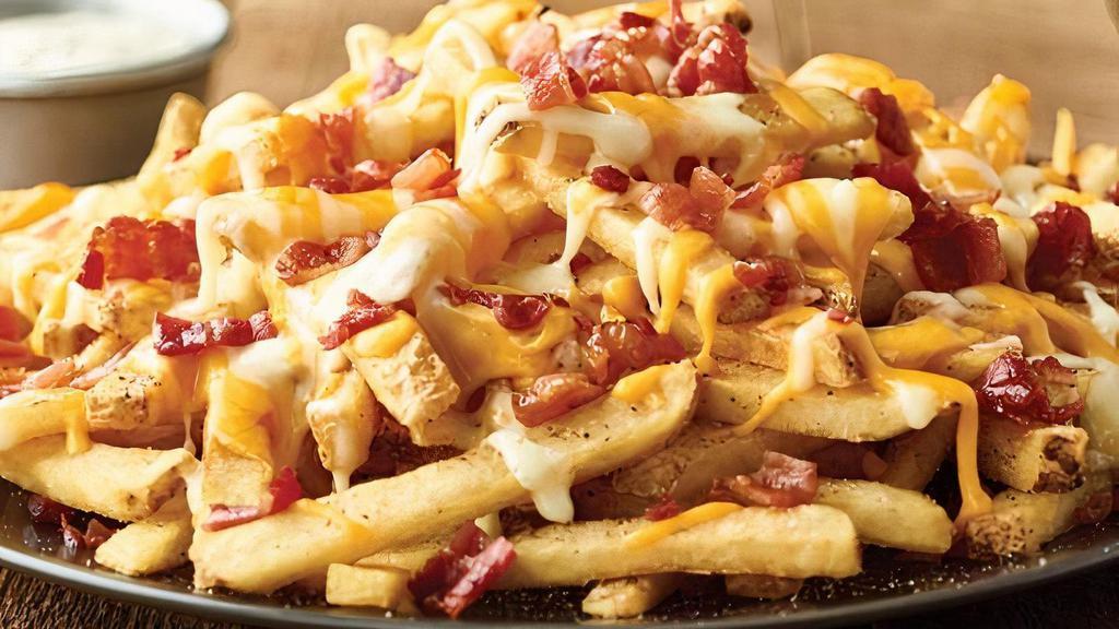 Aussie Cheese Fries · Topped with melted Monterey Jack, Cheddar and chopped bacon with house-made ranch dressing.
