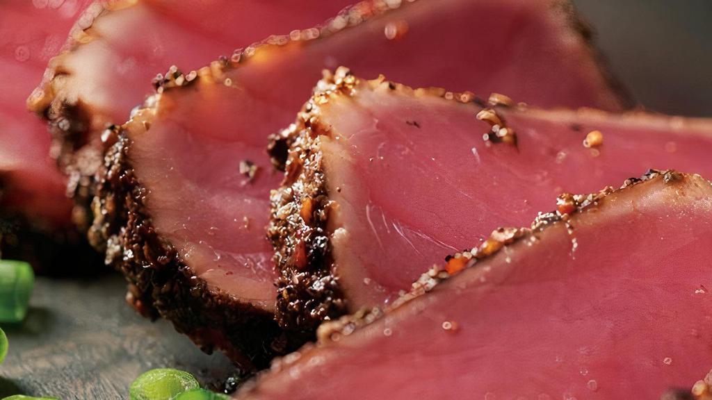 Seared Peppered Ahi · Seared rare with garlic pepper seasoning.
Served with a creamy ginger soy sauce and
wasabi.