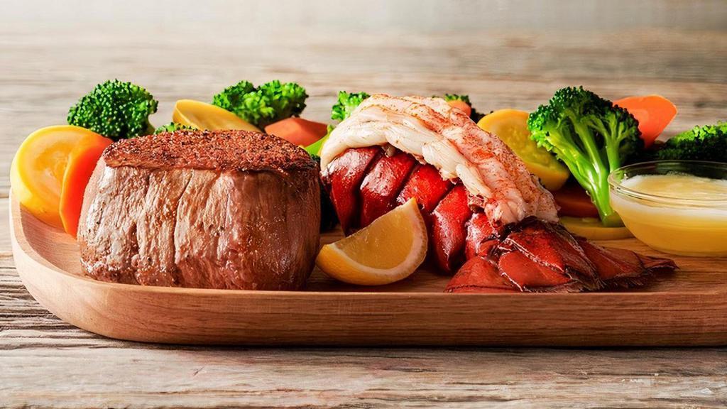 Filet Mignon & Lobster  · A tender and juicy thick cut 6 oz. filet paired with a steamed lobster tail. Served with two freshly made sides.