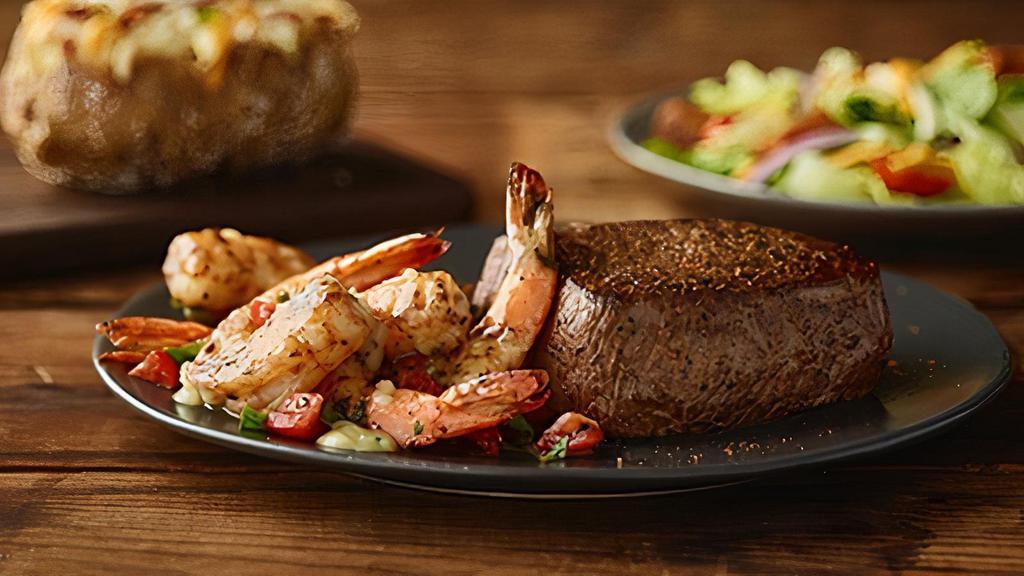 Sirloin & Grilled Shrimp On The Barbie · Our signature center-cut sirloin with Grilled
Shrimp on the Barbie. Served with two freshly made sides.