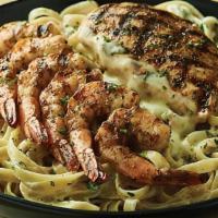 Queensland Chicken & Shrimp Pasta · Fettuccine noodles tossed in a creamy Parmesan cheese sauce with grilled Chicken & Shrimp.
