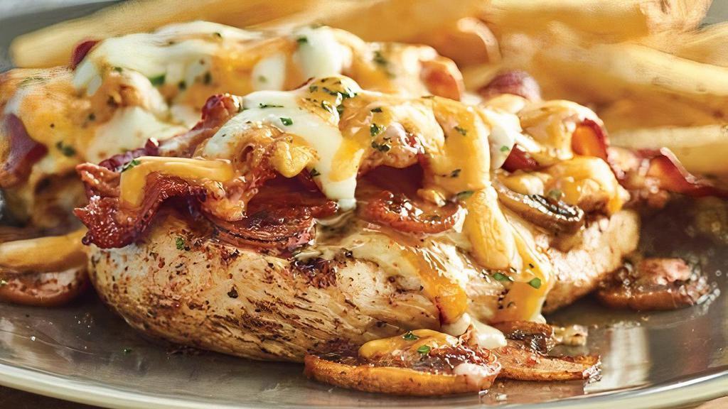 Alice Springs Chicken®  · Grilled chicken breast topped with sautéed mushrooms, crisp bacon, melted Monterey Jack and Cheddar and honey mustard sauce. Served with choice of two freshly made sides.