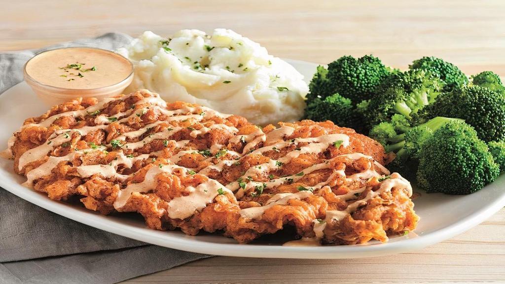 Bloomin' Fried Chicken  · Our twist on fried chicken. Boneless chicken breast
hand battered in our Outback Original Bloomin' Onion®
seasoning, fried until golden brown and drizzled with
our spicy signature bloom sauce. Served with a choice of two freshly made sides.