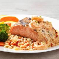 Toowoomba Salmon · Grilled Salmon topped with seasoned and sautéed
shrimp tossed with mushrooms in a creamy cre...