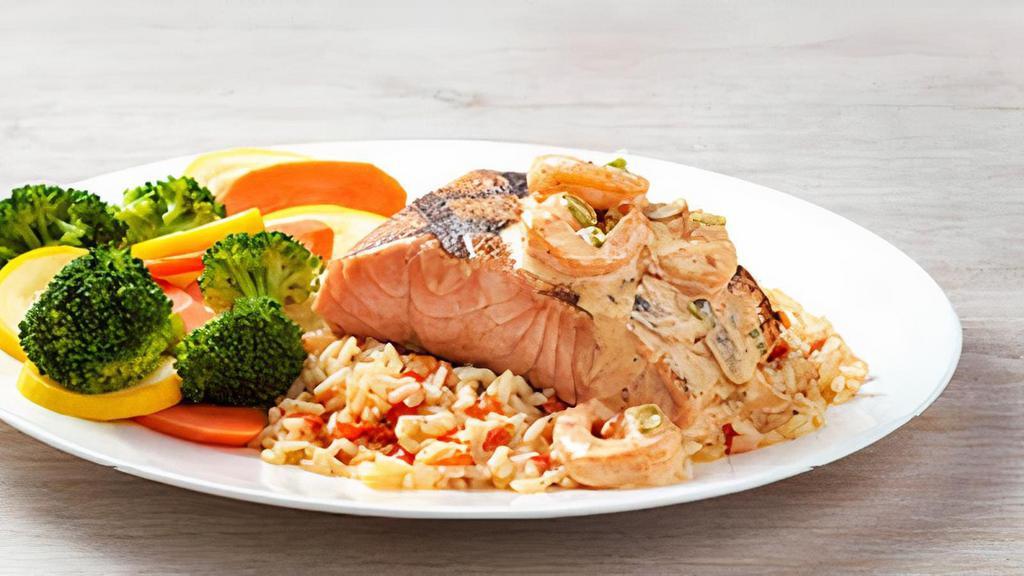 Toowoomba Salmon · Grilled Salmon topped with seasoned and sautéed
shrimp tossed with mushrooms in a creamy creole
sauce. Served with two freshly made sides.