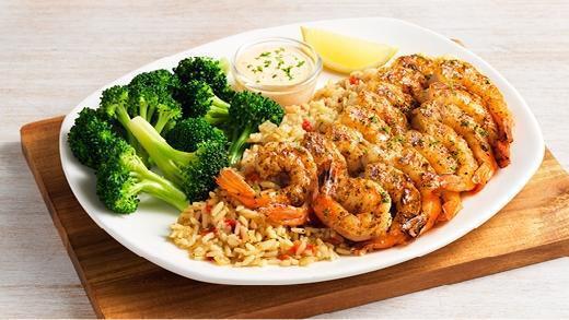 Grilled Shrimp On The Barbie · A generous portion of shrimp seasoned with a special blend of herbs and spices then flame grilled. Served with a classic rémoulade sauce and your choice of two freshly made sides