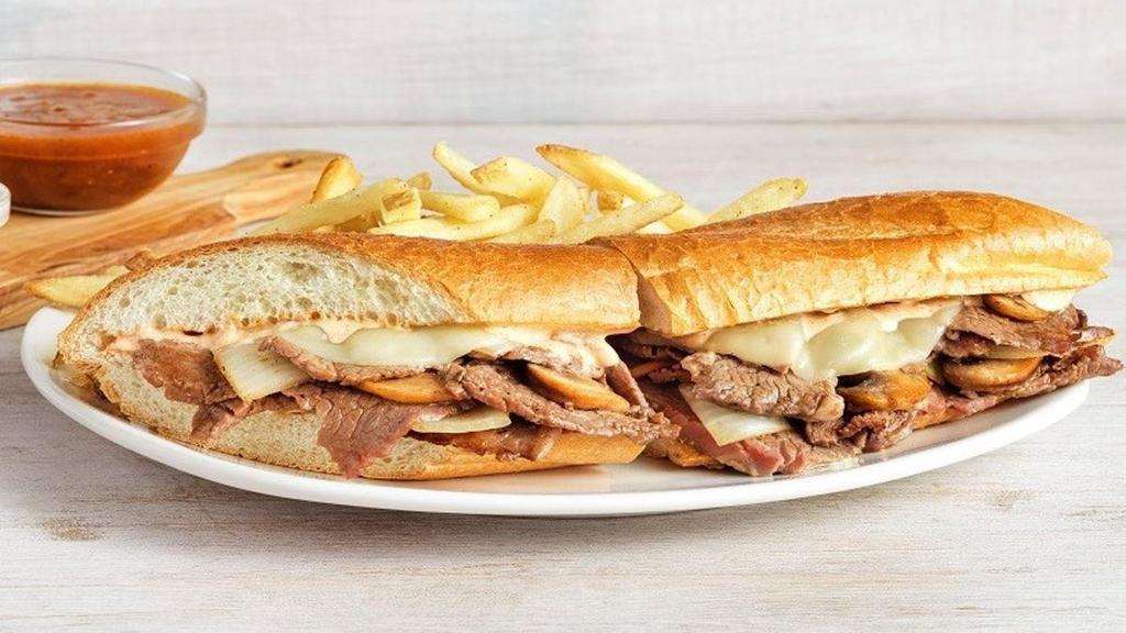 New! Prime Rib Sandwich · Tender slow-roasted prime rib, grilled onions and mushrooms, Provolone cheese, and our spicy signature bloom sauce on a toasted baguette. Served with a side of French onion au jus, creamy horseradish sauce and one freshly made side.