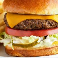 The Outback Burger* · Topped with lettuce, tomato, onion, house-made pickles and mustard. Served with one freshly ...