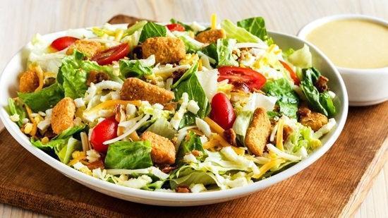 Aussie Cobb Salad  · Fresh mixed greens, chopped hard-boiled eggs, tomatoes, bacon, Monterey Jack and Cheddar cheese and croutons. Served with your choice of dressing.