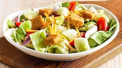 House Salad · Mixed lettuce, dressing of choice, cucumbers, Monterey Jack and Cheddar cheese, tomatoes, red onions and croutons.