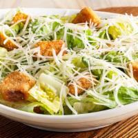 Caesar Salad · Romaine lettuce and croutons tossed with traditional Caesar dressing. Topped with freshly gr...