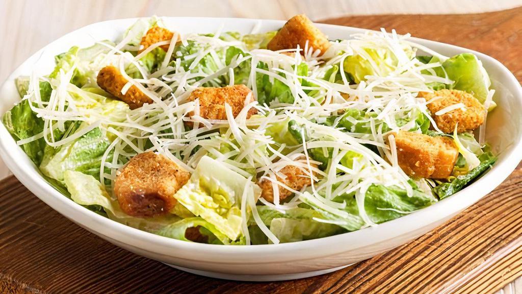 Caesar Salad · Romaine lettuce and croutons tossed with traditional Caesar dressing. Topped with freshly grated Parmesan cheese.