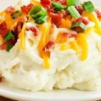 Loaded Mashed Potatoes · Topped with sour cream, bacon, green onions, Monterey Jack and Cheddar cheese.