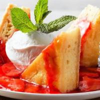 Butter Cake · Sweet and rich butter cake topped with strawberries
and house-made whipped cream.
