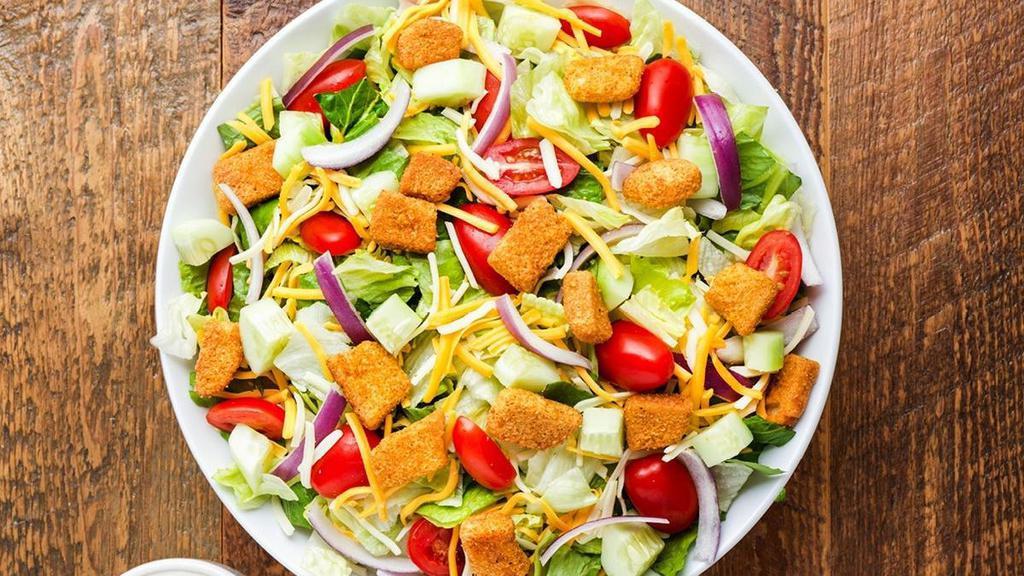 House Salad · Fresh mixed greens, dressing of choice, cucumbers, Monterey Jack and Cheddar cheese, tomatoes, red onions and croutons
