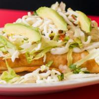 #10 Flautas · Three tightly rolled flour tortillas filled with shredded Chicken and pan fried. Topped with...