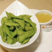 Edamame · Boiled soybeans with natural sea salt. Serves with signature ginger dressing.