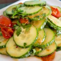 Cucumber Salad · Cucumber salad topped with Kani, serves with vinaigrette dressing.