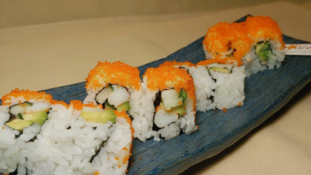 Shrimp Tempura Roll · Shrimp tempura, avocado, and cucumber topped with fish roe masago.