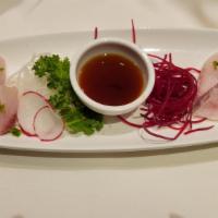 Hamachi Serrano Peppers · Slice of Japanese yellowtail, decorated with serrano pepper and cilantro leaves with hot sau...